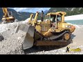 Caterpillar D9N Dozer Digging Gravel in the Water