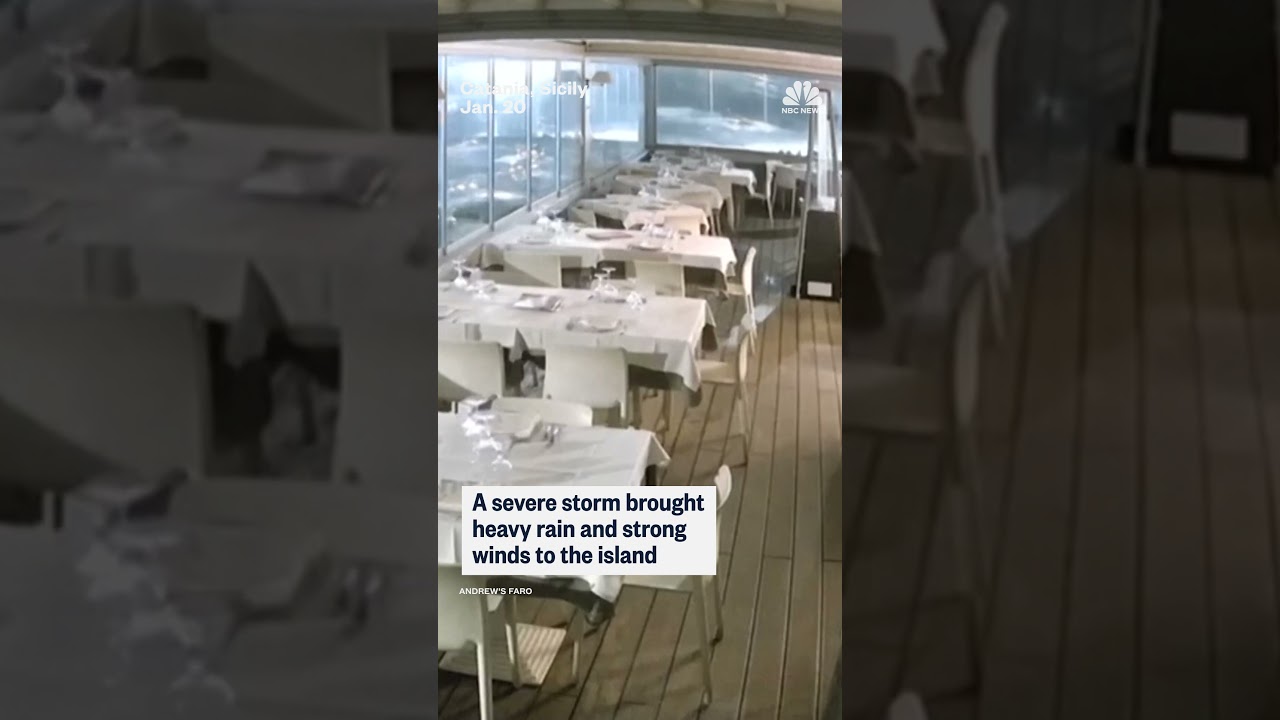 Video shows the moment a storm surge floods the dining room of an Italian seafront restaurant