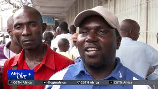 Zimbabwe's government  says economic crisis is over despite scarce commodity