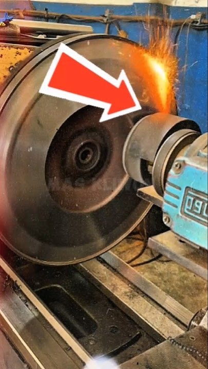 smoothing the surface of the damaged flywheel of a vehicle#shorts #engineering #working#machine #diy