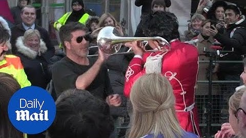 Cowell comes face-to-face with a trumpeter on BGT red carpet - Daily Mail
