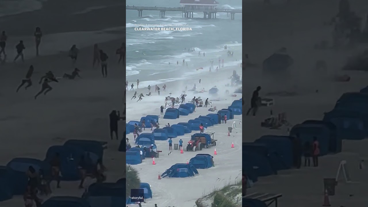 Footage captures waterspout ripping through crowded beach #Shorts