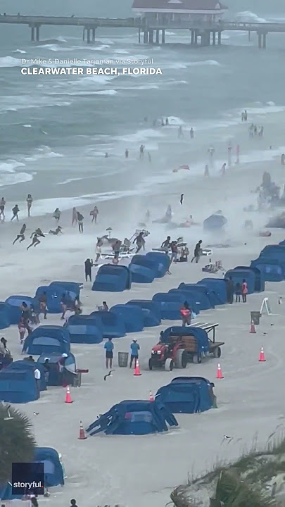 Footage captures waterspout ripping through crowded beach #Shorts