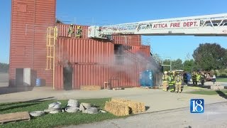Volunteer firefighters conduct live burn training