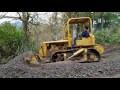 Caterpillar d4 7u dozer pushing gravel