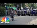Myanmar Nun Stands Between Police and Protesters | NBC News