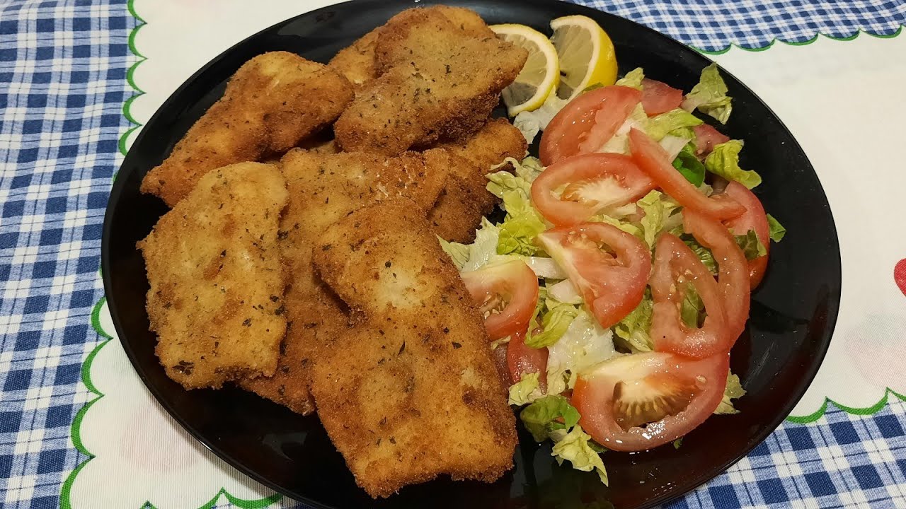 Filetes de merluza empanados .