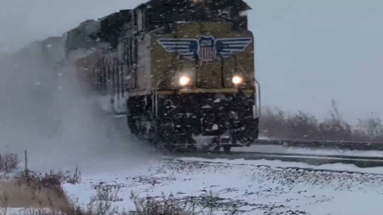 The world's longest train is pulled by four locomotives and traverses the snow.