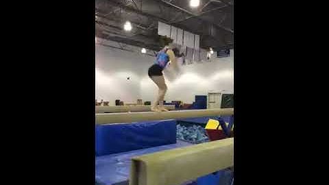 Split jump - tuck full jump on high beam