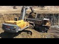 Volvo EC700B Excavator Loading Caterpillar Dumpers
