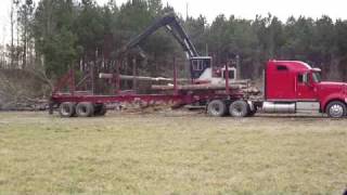 Prentice Log Loader Cutting and Loading Log Trailer