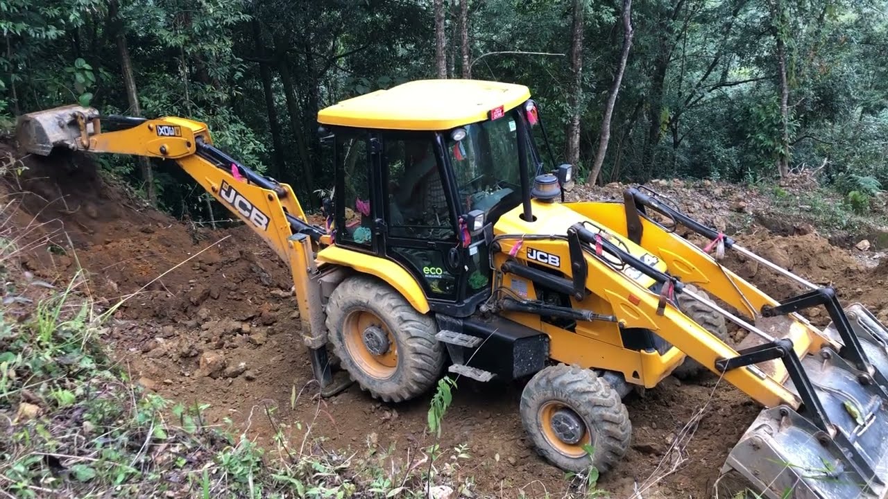 JCB Backhoe Working Hilly New Road Construction