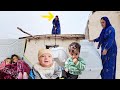 Carrying a tank to the roof by a lone woman in the mountains.