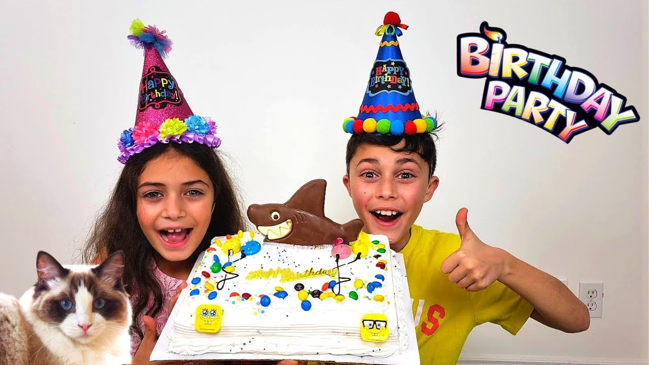 Heidi and Zidane making a Happy Birthday cake for their Cat