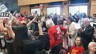 Seattle approves $15 an hour minimum wage