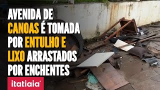 CHUVAS NO RS: AVENIDA DE CANOAS É TOMADA POR ENTULHO APÓS NÍVEL DE ÁGUA ABAIXAR