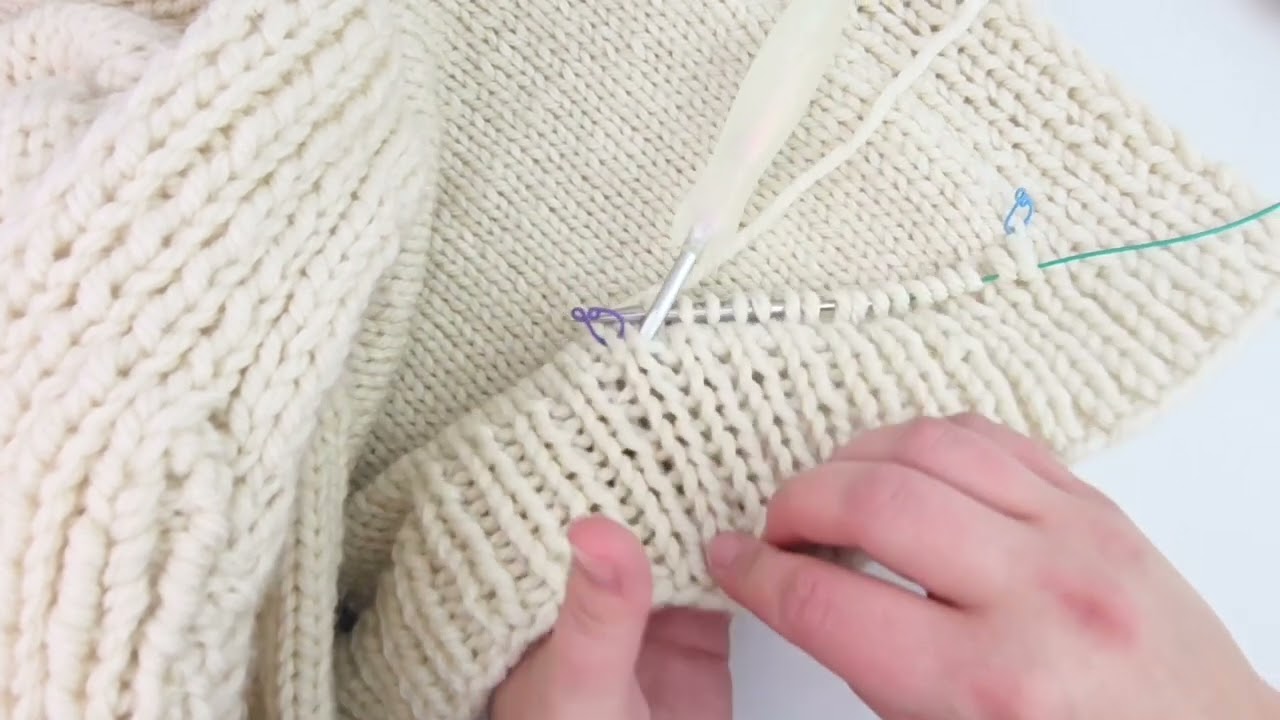 Adding a pocket to my cardigan using a crochet hook to cast on. 