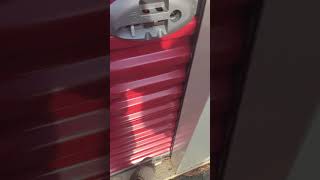 Latching a self storage door properly