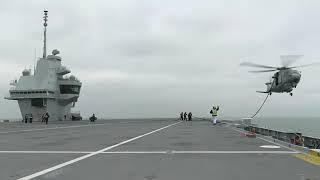 Merlin conducts Helicopter in flight Refuelling HIFR with HMS Queen Elizabeth