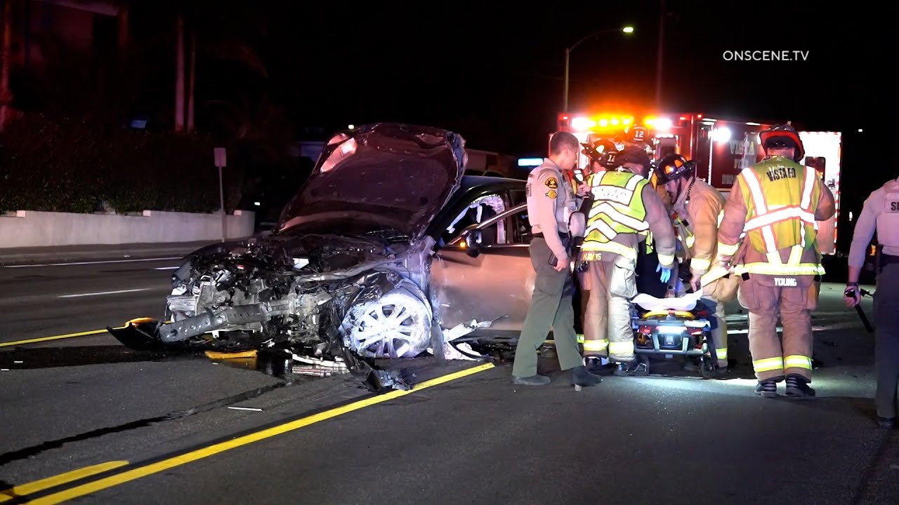 Driver Trapped After Vehicle Crashes into Pole - YouTube