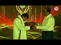 Karunakarareddy guruji getting award from retired ips officer mrshankar bidare