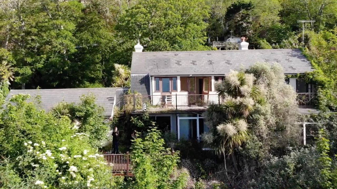 Explorers Visit Abandoned House On Cliff Edge