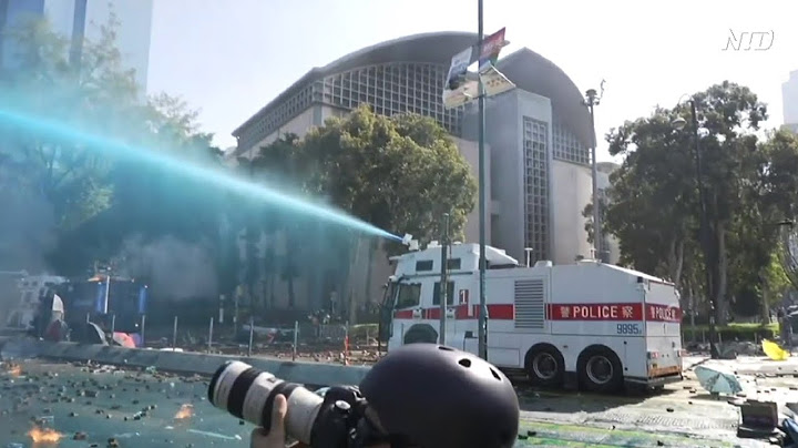 Hong Kong police fire water cannons and tear gas at protesters at university campus