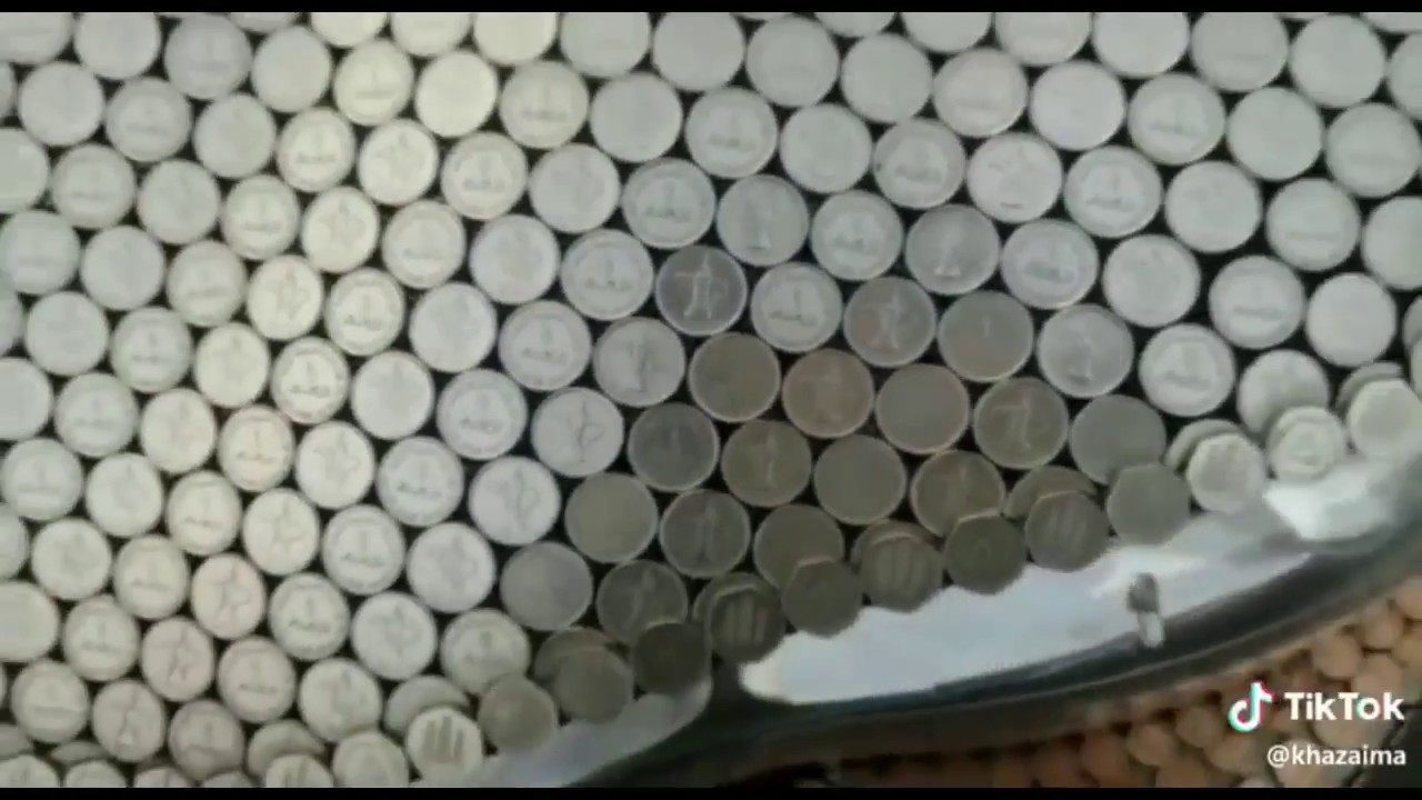 UAE dinaar coin covered a car .Mr India