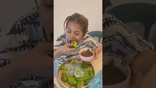 Eat baby green mango with Prahok Khmer sauce