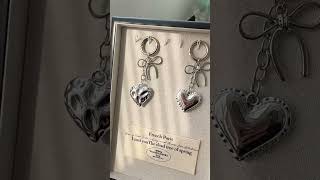 Y2K liquid silver bow & puffed heart bag charms 😭🎀 #wholesaleaccessories #boutiquesourcing