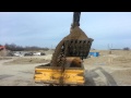 Loading rock trucks with a 470G excavator