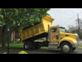 Dump truck dumping mulch