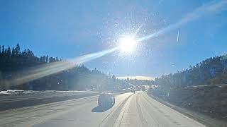 Driving through Donner Pass a few days after a snow storm full speed.