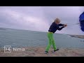 boy with blue umbrella in strong wind