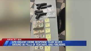 LPD: Two arrested after officers seize guns, fentanyl, & over $7K