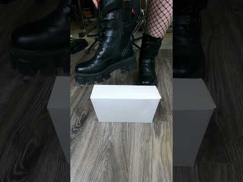 Girl in boots crushes box