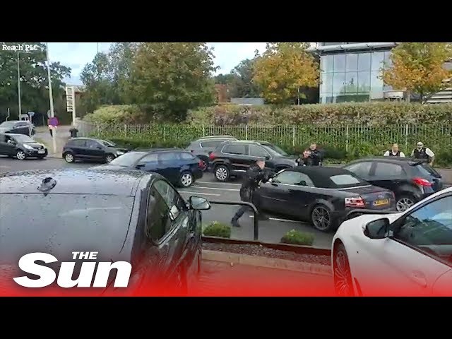 Dramatic moment UK armed cops swoop in on Audi in North London class=