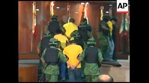 Mexican soldiers arrest a suspected drug gang leader