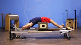 Advanced Round Back on Short Box on Pilates Reformer