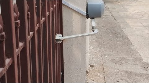Articulated arm swing gate motor