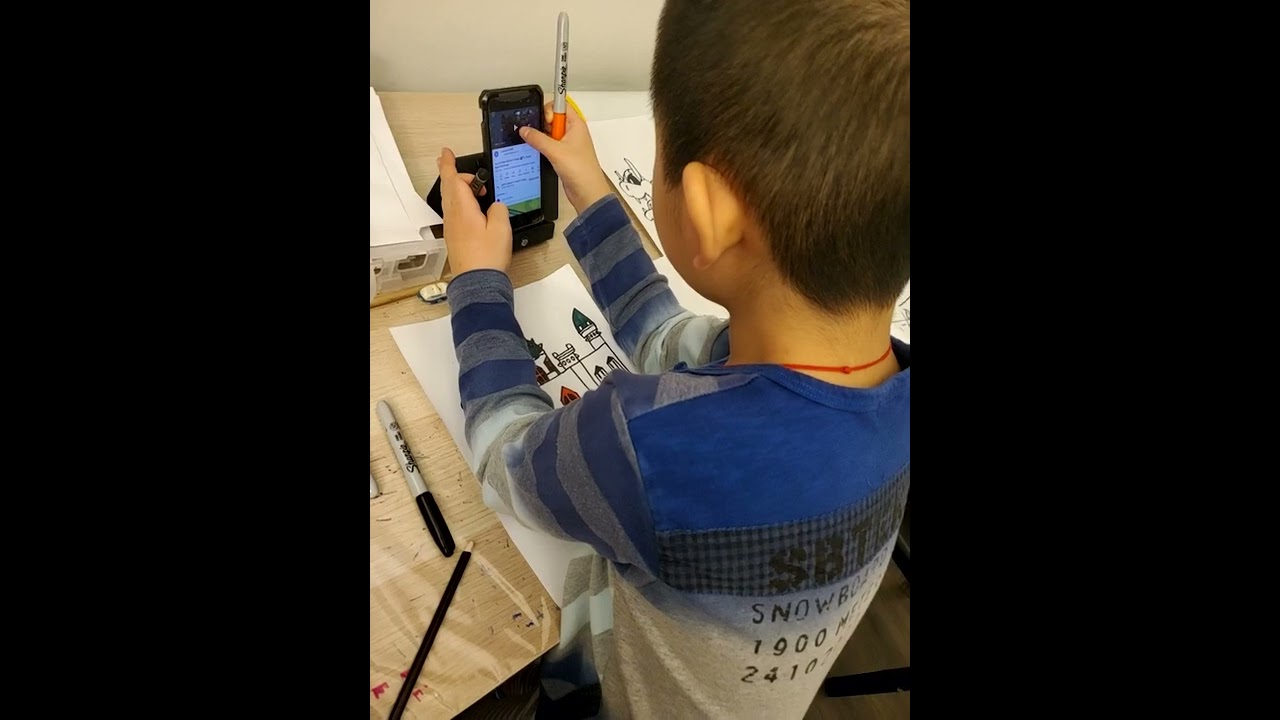 James Cheng and Jacqueline Cheng drawing Bowser and Bowser's castle.