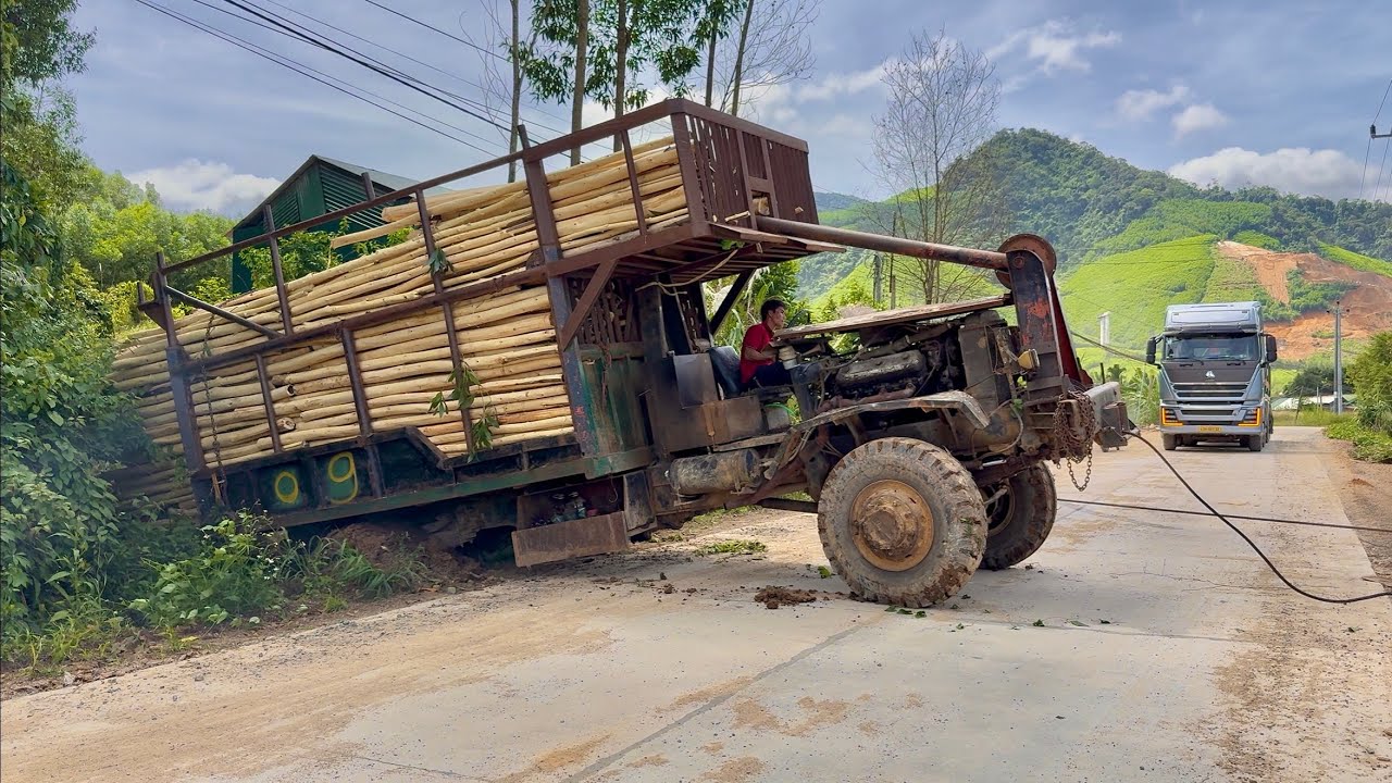 A very sturdy and durable old truck from 1975 transporting wood in Vietnam