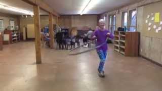 Lynn dances with hulu hoop to drum circle