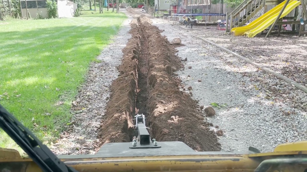 Trenching 400' of underground data with Cat 247b