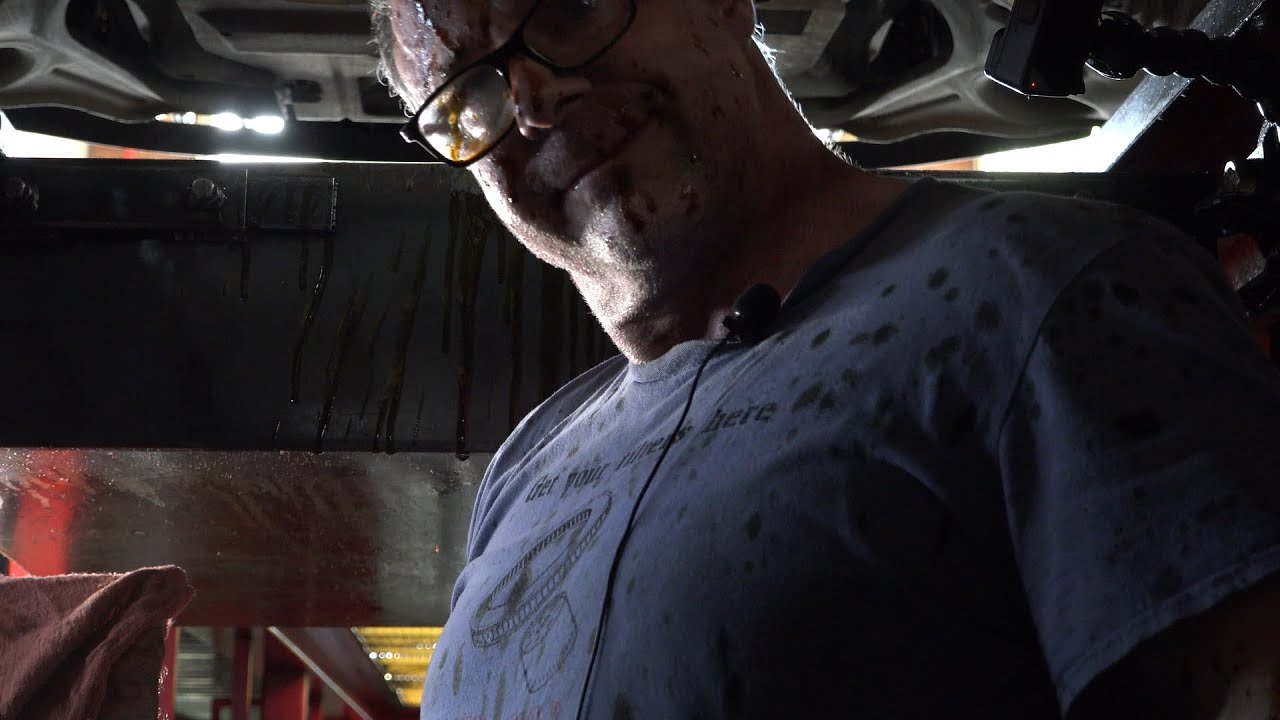 Working the pit at an oil change shop/lube shop