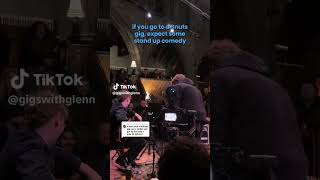 My youngest son telling bad dad jokes at the snuts gig.