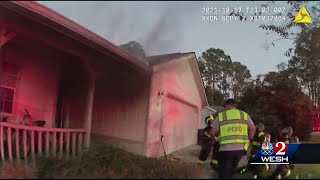 Bodycam video shows deputy rescue a 3-year-old hiding from fire
