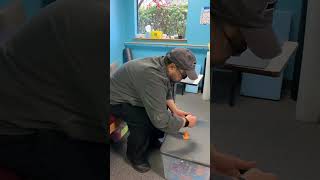 Stroke Rehab : Take the cones from the lower to higher table.