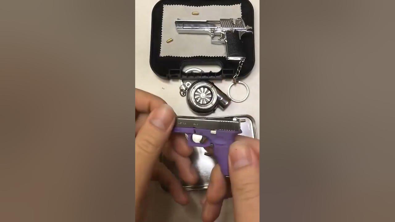 Do you like mini glock keychain with bullets?😍ematok minigun glock34