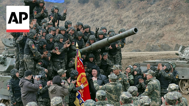 North Korea's Kim Jong Un drives tank at military exercises